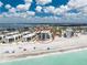 Aerial showcasing beachside condo's prime location with easy access to the white sand beach and the inter-coastal waterway at 2792 N Beach Rd # 301, Englewood, FL 34223