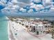 Aerial view showcasing a beachfront condo building with stunning coastal surroundings at 2792 N Beach Rd # 301, Englewood, FL 34223