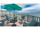 Relax on this spacious balcony with amazing ocean views, stylish seating and a table with a large patio umbrella at 2792 N Beach Rd # 301, Englewood, FL 34223