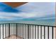 Enjoy breathtaking views of the ocean from this outdoor balcony with a black railing and tiled patio at 2792 N Beach Rd # 301, Englewood, FL 34223