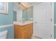 Updated bathroom features a modern vanity with oak cabinets and ample storage at 2792 N Beach Rd # 301, Englewood, FL 34223