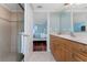 Bathroom with a wood vanity and an open doorway to the bedroom at 2792 N Beach Rd # 301, Englewood, FL 34223