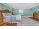 Relaxing bedroom features a decorative rug, natural light, and a ceiling fan at 2792 N Beach Rd # 301, Englewood, FL 34223