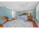Spacious bedroom features hardwood floors and plenty of natural light at 2792 N Beach Rd # 301, Englewood, FL 34223