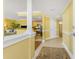 Bright entryway showing the living and kitchen area with tile floors at 2792 N Beach Rd # 301, Englewood, FL 34223