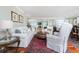 Bright living room with hardwood floors, plush seating, and elegant decor throughout the open floor plan at 2792 N Beach Rd # 301, Englewood, FL 34223