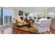 Inviting living room with access to the balcony, a fireplace, and comfortable seating arrangement at 2792 N Beach Rd # 301, Englewood, FL 34223