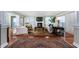 Elegant living room featuring hardwood floors, a fireplace, and abundant natural light with ocean views at 2792 N Beach Rd # 301, Englewood, FL 34223