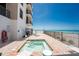 Enjoy the spa with views of the beach from this exterior view of the building near the sandy dunes at 2792 N Beach Rd # 301, Englewood, FL 34223