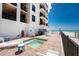 This outdoor spa has views of the beach and the building's balconies for a luxurious and relaxing getaway at 2792 N Beach Rd # 301, Englewood, FL 34223
