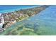 Stunning aerial view of the coastal community, showcasing waterfront homes and lush landscapes at 2980 N Beach Rd # Gv16, Englewood, FL 34223