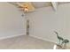 Spacious bedroom with wood ceiling, tile floors and view to the hallway at 2980 N Beach Rd # Gv16, Englewood, FL 34223