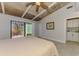 Bedroom with wood ceiling and private access to outdoor space with brick patio at 2980 N Beach Rd # Gv16, Englewood, FL 34223