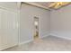 Bedroom with wood ceiling, tile floors and adjacent bathroom access at 2980 N Beach Rd # Gv16, Englewood, FL 34223