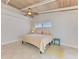 Bedroom with wood ceiling and tile floors; bright and airy with a cozy feel at 2980 N Beach Rd # Gv16, Englewood, FL 34223