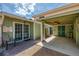 Exterior of home featuring carport, brick paved patio, and pale-green painted exterior walls at 2980 N Beach Rd # Gv16, Englewood, FL 34223