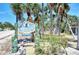 Charming community sign for Admiralty Villas, surrounded by lush landscaping at 2980 N Beach Rd # Gv16, Englewood, FL 34223