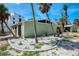 Charming single-story home featuring landscaped yard, palm trees and an architectural angular roof at 2980 N Beach Rd # Gv16, Englewood, FL 34223