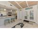 Kitchen with stainless steel appliances, backsplash and breakfast bar with seating at 2980 N Beach Rd # Gv16, Englewood, FL 34223