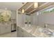 Well-lit kitchen featuring stainless steel appliances, stone countertops, and plenty of cabinet space at 2980 N Beach Rd # Gv16, Englewood, FL 34223