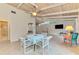 Spacious living area with dining area, tile floors, vaulted ceiling, and lots of light at 2980 N Beach Rd # Gv16, Englewood, FL 34223