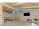 Bright living room with tile flooring, vaulted ceilings, and French doors leading to the outside at 2980 N Beach Rd # Gv16, Englewood, FL 34223