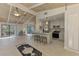 Open living area with kitchen island, vaulted ceilings, and access to outdoor patio at 2980 N Beach Rd # Gv16, Englewood, FL 34223
