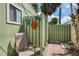 Private outdoor shower area with whimsical seaside decor, greenery and room to relax at 2980 N Beach Rd # Gv16, Englewood, FL 34223