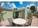 Cozy outdoor patio with chairs and a table, perfect for relaxing and enjoying the outdoors at 2980 N Beach Rd # Gv16, Englewood, FL 34223