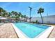 Sparkling community pool with lounge chairs for sunny relaxation and leisure at 2980 N Beach Rd # Gv16, Englewood, FL 34223