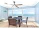 Screened balcony with dining set features beautiful beachfront views at 301 S Gulf Blvd # 419, Placida, FL 33946
