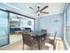 Screened balcony with seating area and partial view of the living room at 301 S Gulf Blvd # 419, Placida, FL 33946