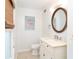 Charming bathroom features a vanity with elegant mirror, toilet, and stylish accents at 301 S Gulf Blvd # 419, Placida, FL 33946