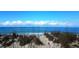 Ocean view with native grasses and a calm surf at 301 S Gulf Blvd # 419, Placida, FL 33946