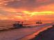 Beautiful beach view with boats on the shore at sunset, creating a tranquil and picturesque scene at 301 S Gulf Blvd # 419, Placida, FL 33946