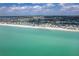 Wide sandy beach featuring beachfront homes and turquoise ocean water at 301 S Gulf Blvd # 419, Placida, FL 33946