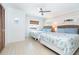 Bedroom with two beds, window and coastal decor at 301 S Gulf Blvd # 419, Placida, FL 33946