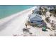Coastal home with a gray exterior, situated on a white sandy beach with beautiful ocean views at 301 S Gulf Blvd # 419, Placida, FL 33946