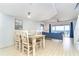 Cozy dining area opens to a bright living space with ocean view and access to balcony at 301 S Gulf Blvd # 419, Placida, FL 33946