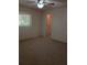 Bedroom features plush carpet, a window, and an open door leading to a closet at 3278 Cabaret St, Port Charlotte, FL 33948