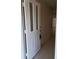 Entrance door with glass panels leading into a tiled hallway at 3278 Cabaret St, Port Charlotte, FL 33948