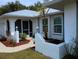 Beautiful single Gathering home with a well-manicured lawn and tropical foliage at 3278 Cabaret St, Port Charlotte, FL 33948