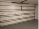 View of the interior mechanics of a white garage door at 3278 Cabaret St, Port Charlotte, FL 33948