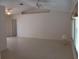 Open living room features vaulted ceiling, neutral paint, ceramic tile flooring and natural light at 3278 Cabaret St, Port Charlotte, FL 33948