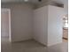 Spacious living room has neutral paint and ceramic tile flooring with access to other rooms at 3278 Cabaret St, Port Charlotte, FL 33948