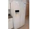 The image shows a white side-by-side refrigerator with water and ice dispenser at 3278 Cabaret St, Port Charlotte, FL 33948