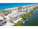 Attractive aerial view of a beach home with a private dock providing access to the Gulf and canal at 342 S Gulf Blvd, Placida, FL 33946