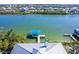Stunning aerial view of a waterfront home with a private dock and serene canal access at 342 S Gulf Blvd, Placida, FL 33946