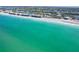 Incredible aerial view of a Gulf-front home on a beautiful beach, complemented by a tranquil canal backdrop at 342 S Gulf Blvd, Placida, FL 33946