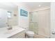 Well lit bathroom featuring a glass shower door, and an open vanity at 342 S Gulf Blvd, Placida, FL 33946